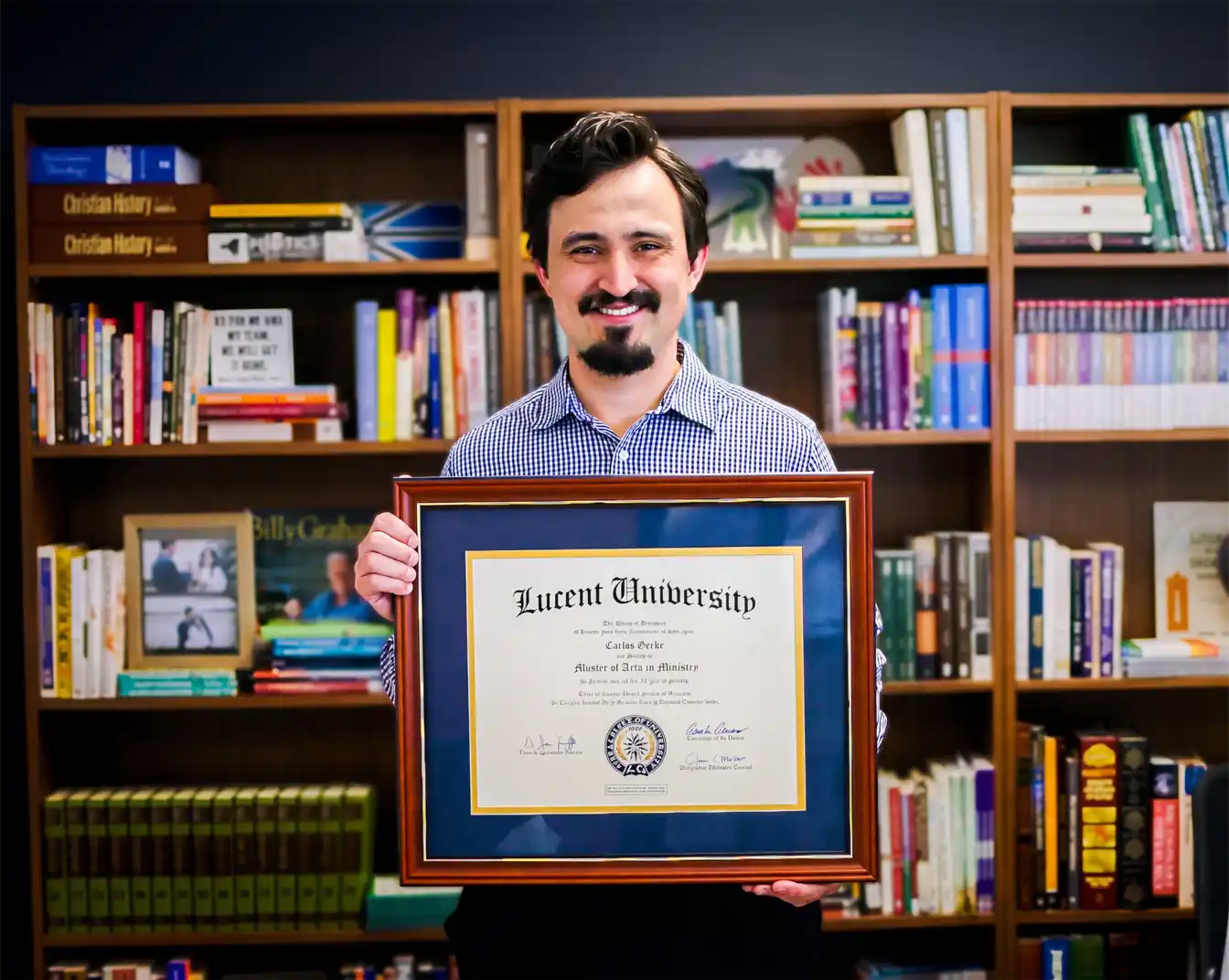 Successful online theology graduate Carlos Gerke holding his ministry degree